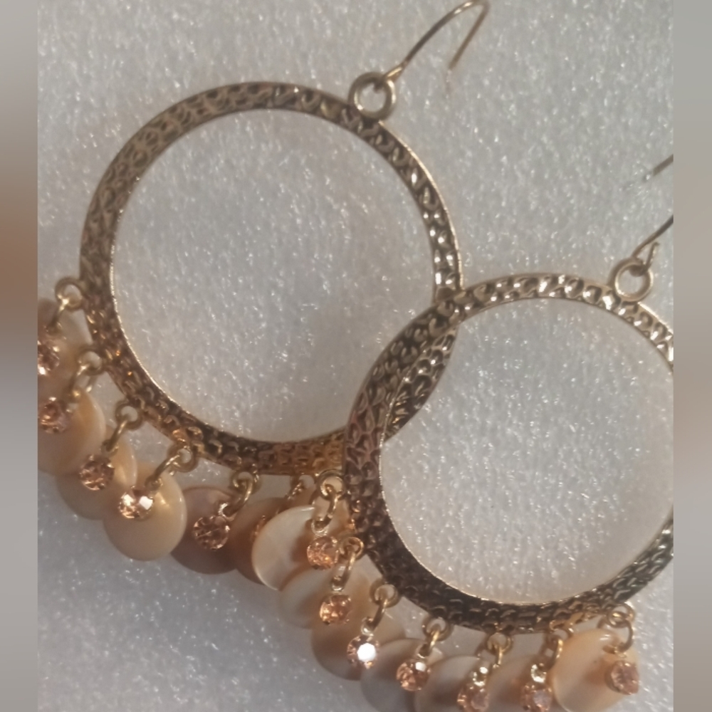 Circle hoop dangle earrings with a tan shell accent & crystal beaded